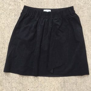 Black suede miniskirt.